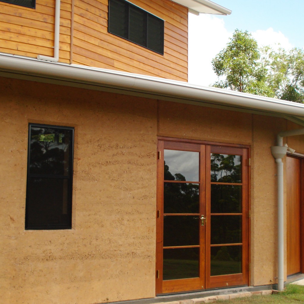 rammed earth curved front home
