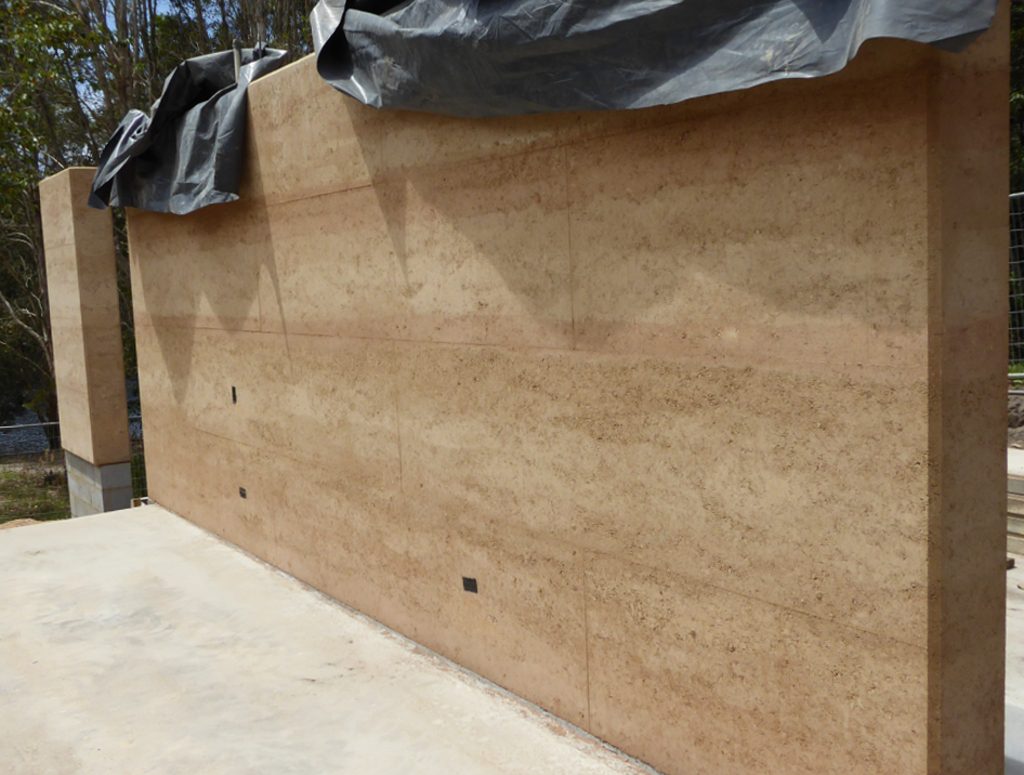Newly finished rammed earth wall